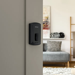 Kwikset Unite matte black deadbolt on door.