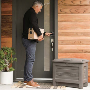 Man picking up deliveries from Yale Smart Storage Box