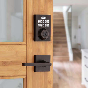 Kwikset bronze smart lock on wood door